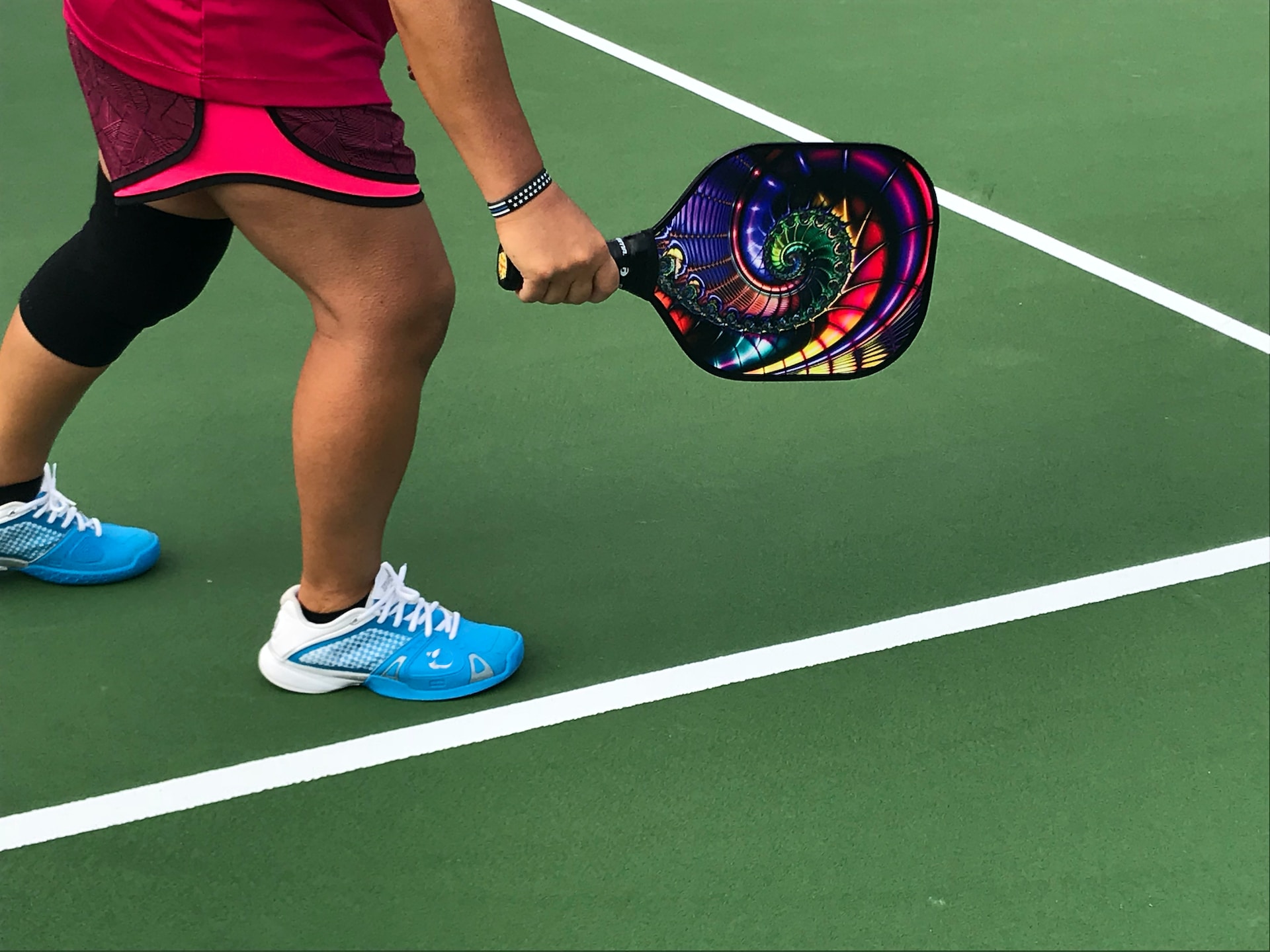 Photo of a person playing pickleball